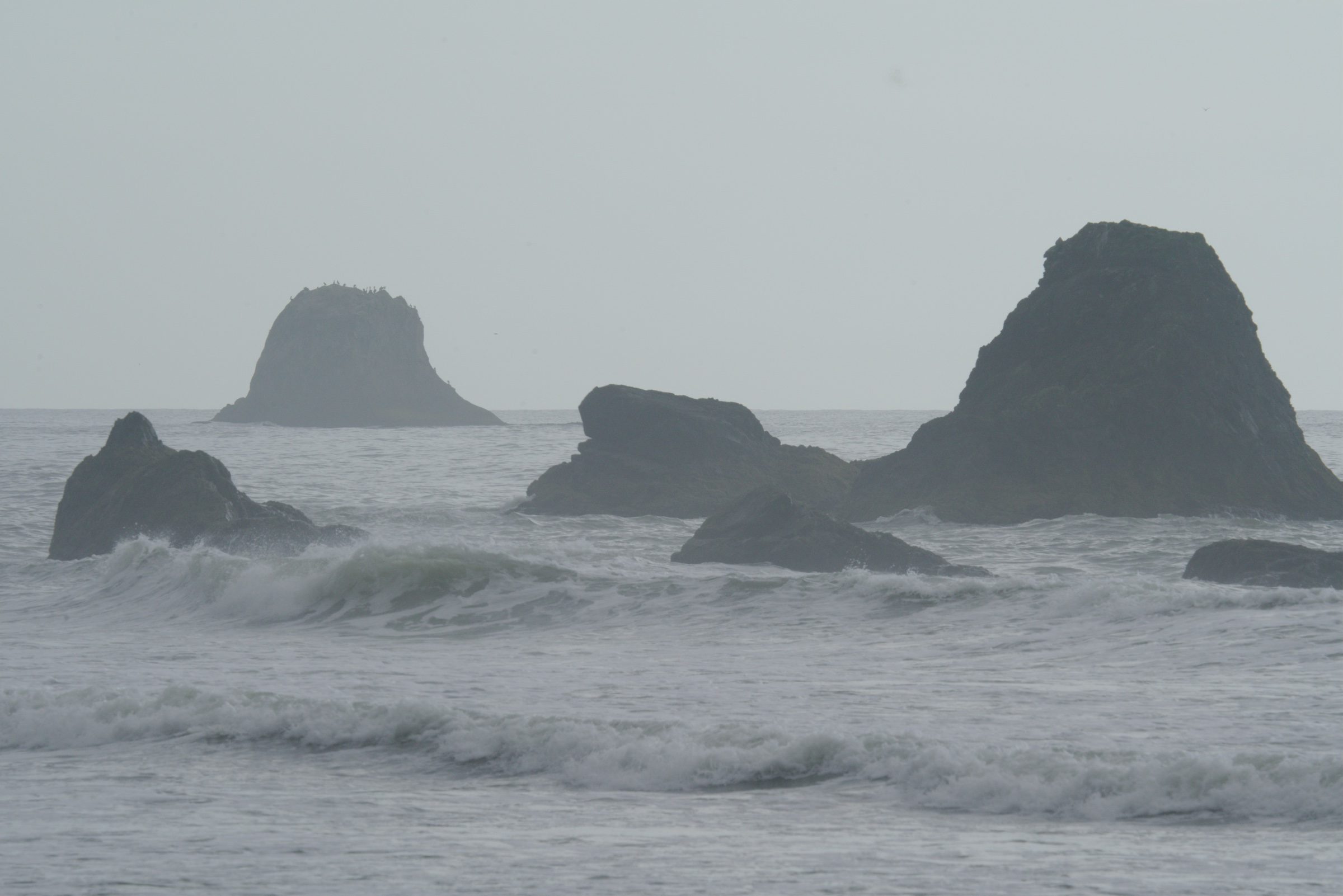 Yours: sea stacks in grey surf, as shot.